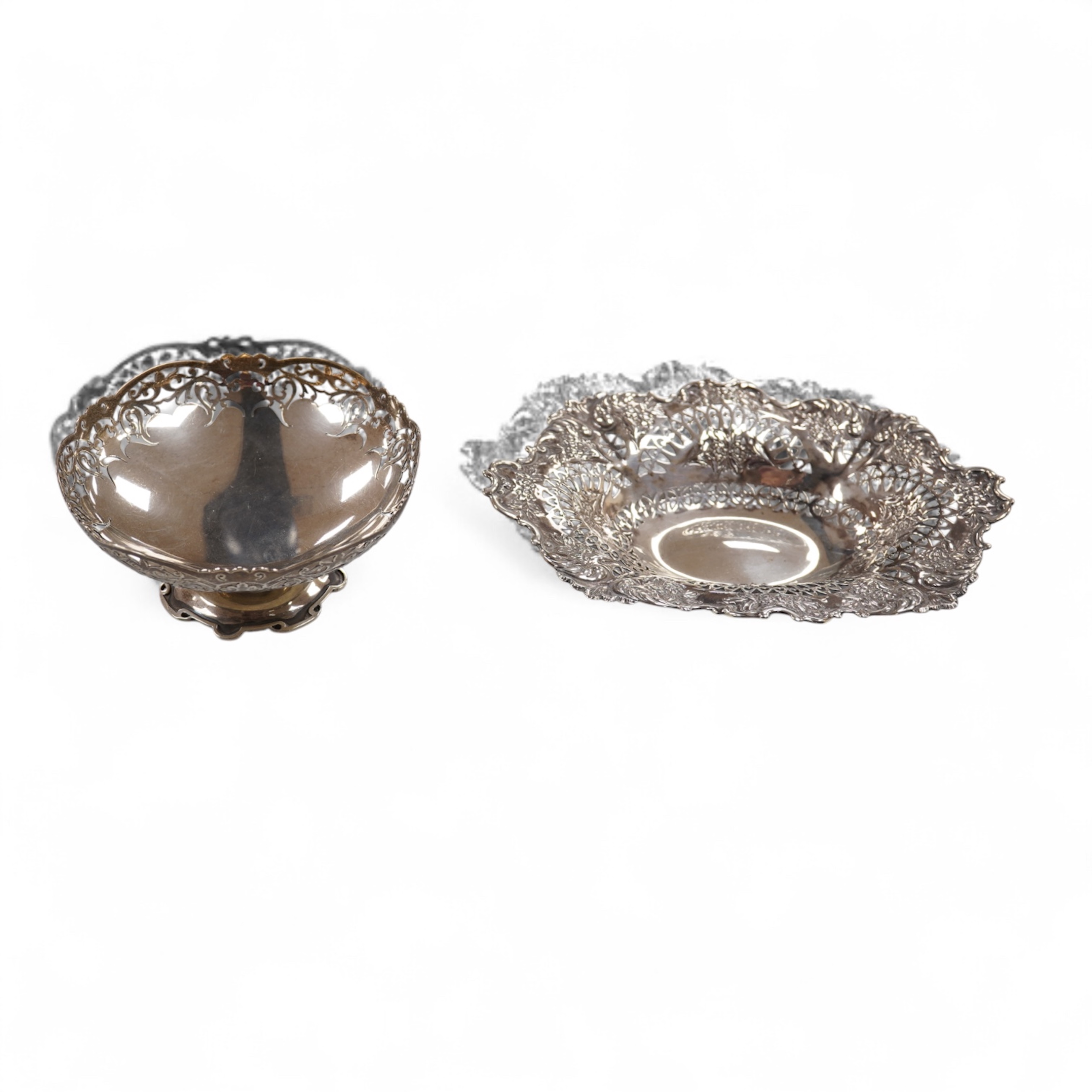 A late Victorian repousse silver oval bonbon dish, Martin, Hall & Co, Sheffield, 1895, length 20.8cm, together with an Elizabeth II pieced silver pedestal bonbon dish by Asprey & Co Ltd, London, 1965, 10.8oz.